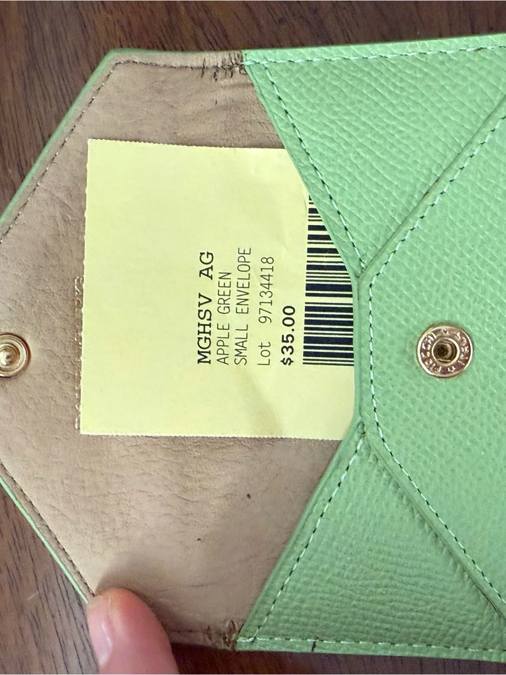 Set of 2 Dooney and Bourke Apple green leather envelopes. Gently used.